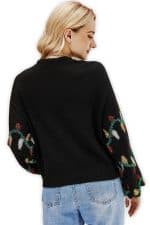 pull noel femme guirlande vue de dos