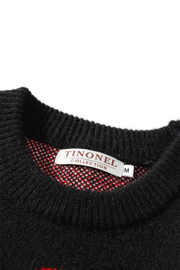 pull noir santa claus vue du col